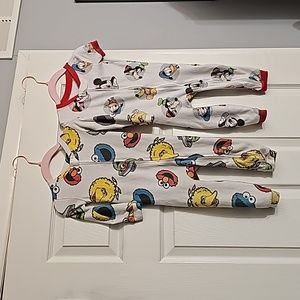 2 for $15  Sesame Stree 18m t pajama set 1 long sleeve and 1 short sleeve.